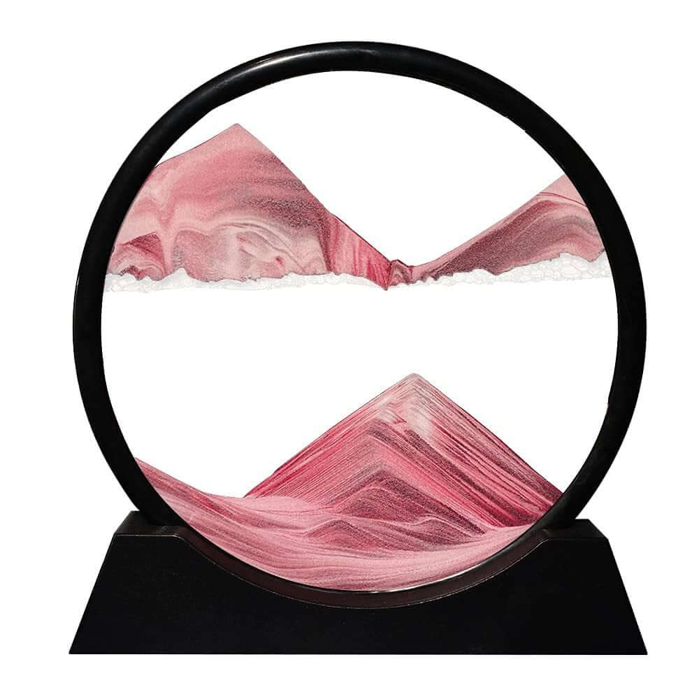 3D moving sand art showing dynamic pink landscapes in a circular black frame, perfect for home and office decor.