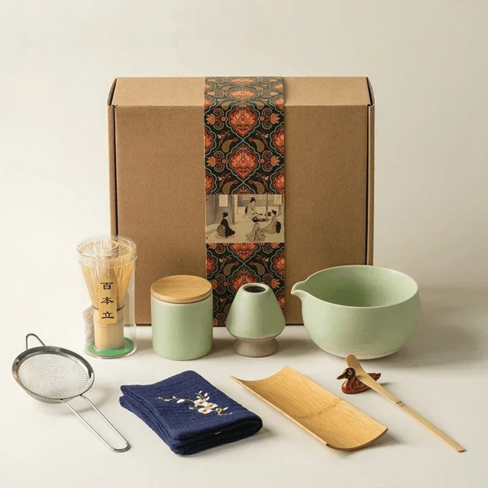 9-Piece Matcha Set - Premium Ceramic Bowl, Bamboo Whisk displayed with tools and packaging.