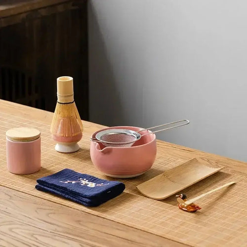 9-Piece Matcha Set - Premium Ceramic Bowl, Bamboo Whisk displayed on wooden table with various tea tools.