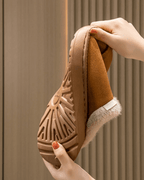 Close-up of autumn and winter plush slipper sole showcasing non-slip design and warm lining for cozy comfort.