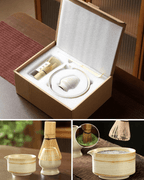 Premium ceramic matcha set in packaging with bamboo whisk, scoop, and holder for enthusiasts.
