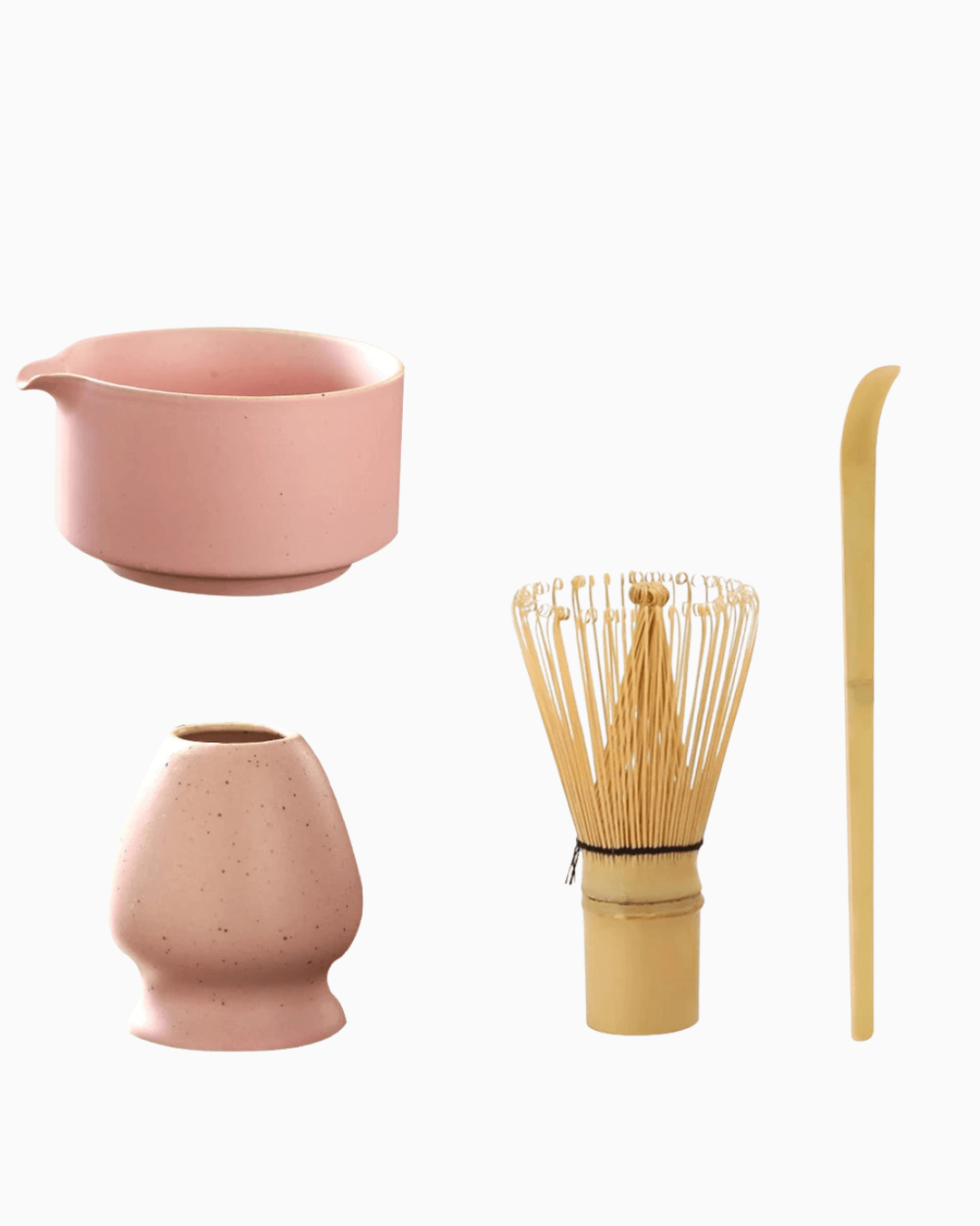 Ceramic matcha set featuring a pink bowl, bamboo whisk, scoop, and holder for matcha preparation.
