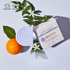 Biotin purple toning solid conditioner bar with orange and greenery for brighter hair, eco-friendly and vegan.