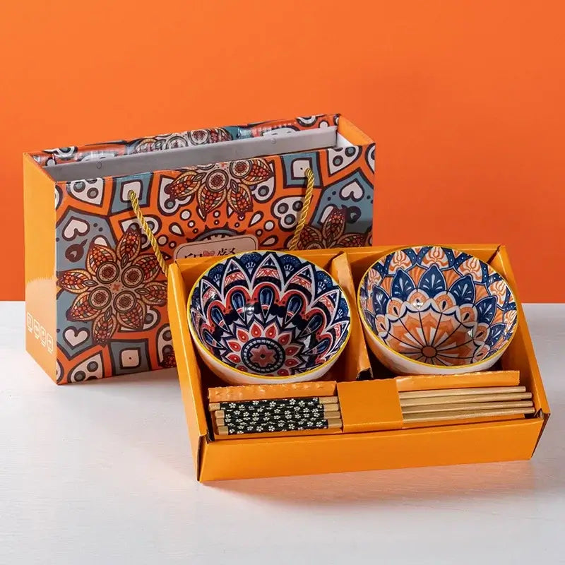 Hand-painted ceramic bowl set with chopsticks in a decorative gift box, featuring vibrant Bohemian designs.