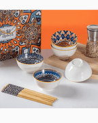 Hand-painted ceramic bowl set featuring vibrant Bohemian designs, chopsticks, and an elegant gift box.