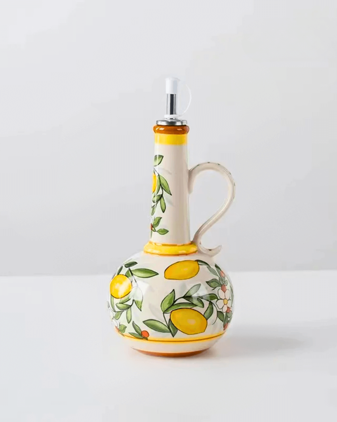 Hand-painted ceramic olive oil dispenser 550ml with lemon design and metal spout, ideal for kitchen decor.