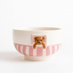 Ceramic bowl from Sweet Dream Bear Tableware Set with whimsical bear design and pink stripes.