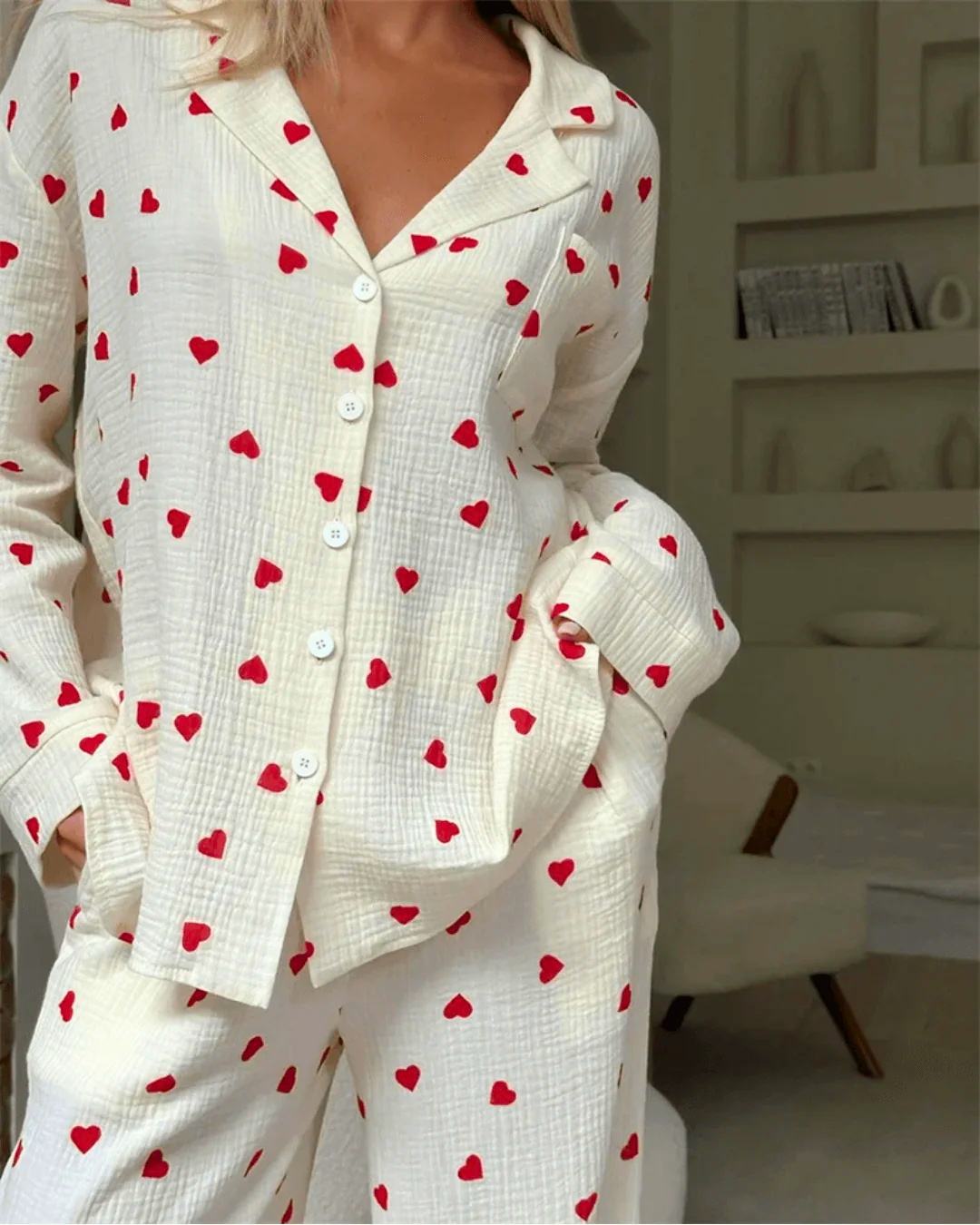 Model wearing Women's 100% Cotton Heart Print Pyjama Set with button-down top and elastic-waist pants.