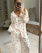 Women's 100% cotton heart print pyjama set, featuring a button-down top and matching wide-leg pants.