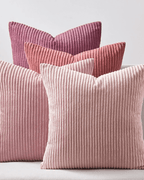 Soft pink and purple corduroy decorative pillow covers stacked together, showcasing a cozy boho style.