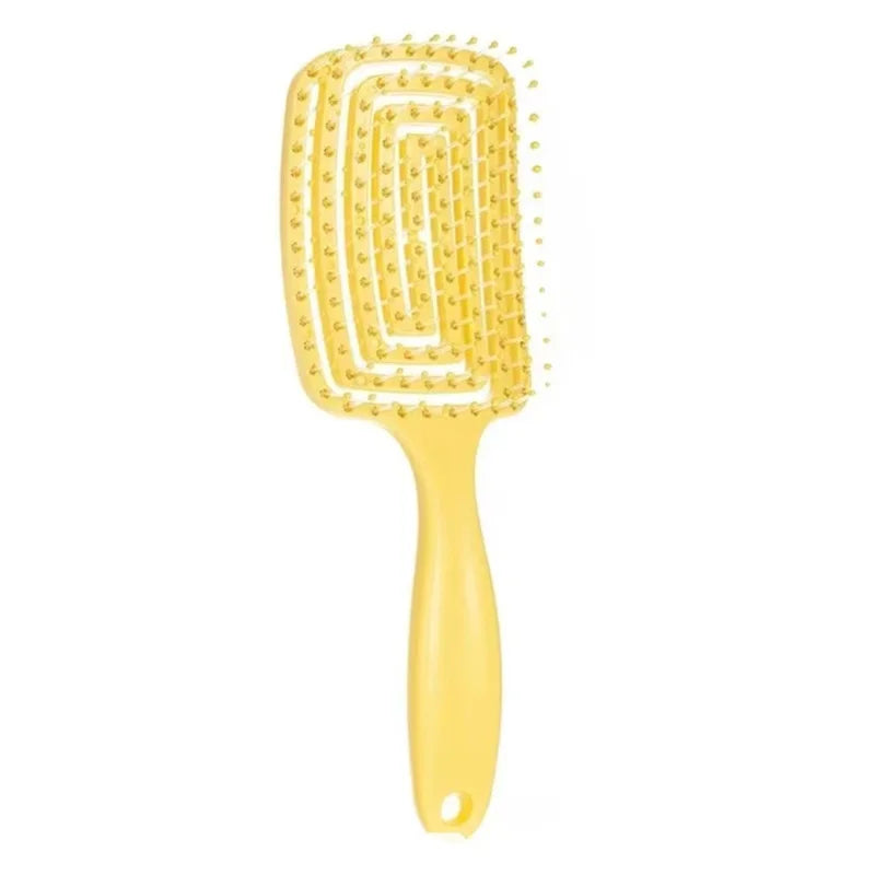 Yellow hollow vent detangling hair brush with soft bristles for scalp massage and fast drying.