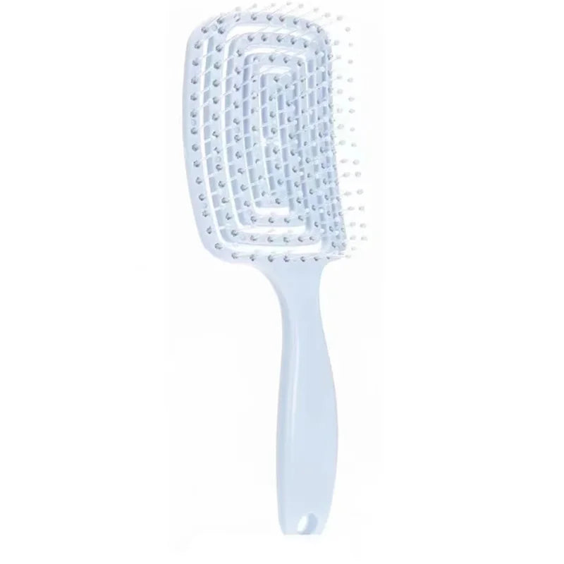 Detangling hair brush with hollow vent design for fast drying and scalp massage, ideal for smooth and healthy hair.