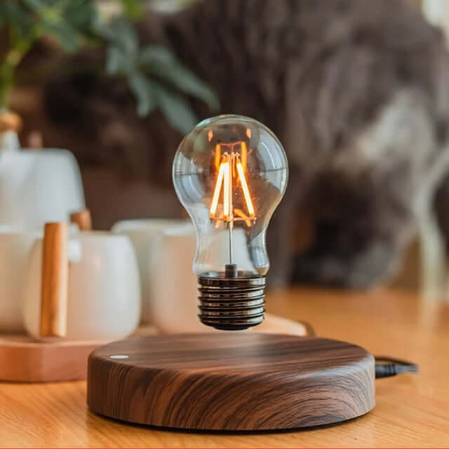 LED bulb levitating above a walnut base, showcasing modern design and adjustable ambiance lighting.
