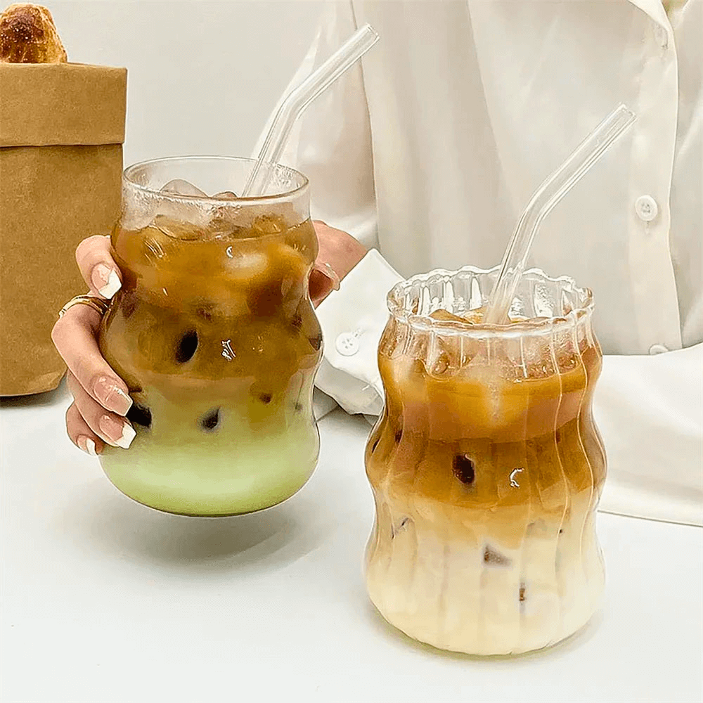 Two heat-resistant wavy matcha tumblers filled with iced beverages, showcasing layered drinks for perfect sipping.