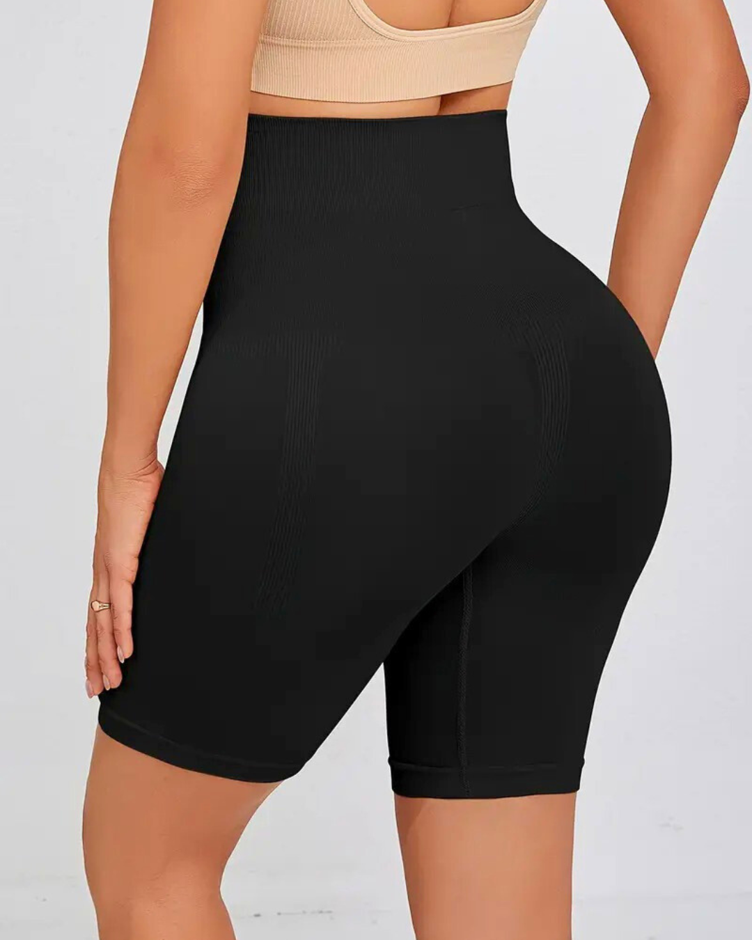 High-waist seamless shapewear shorts in black, providing tummy control and a smoothing silhouette for all-day comfort.