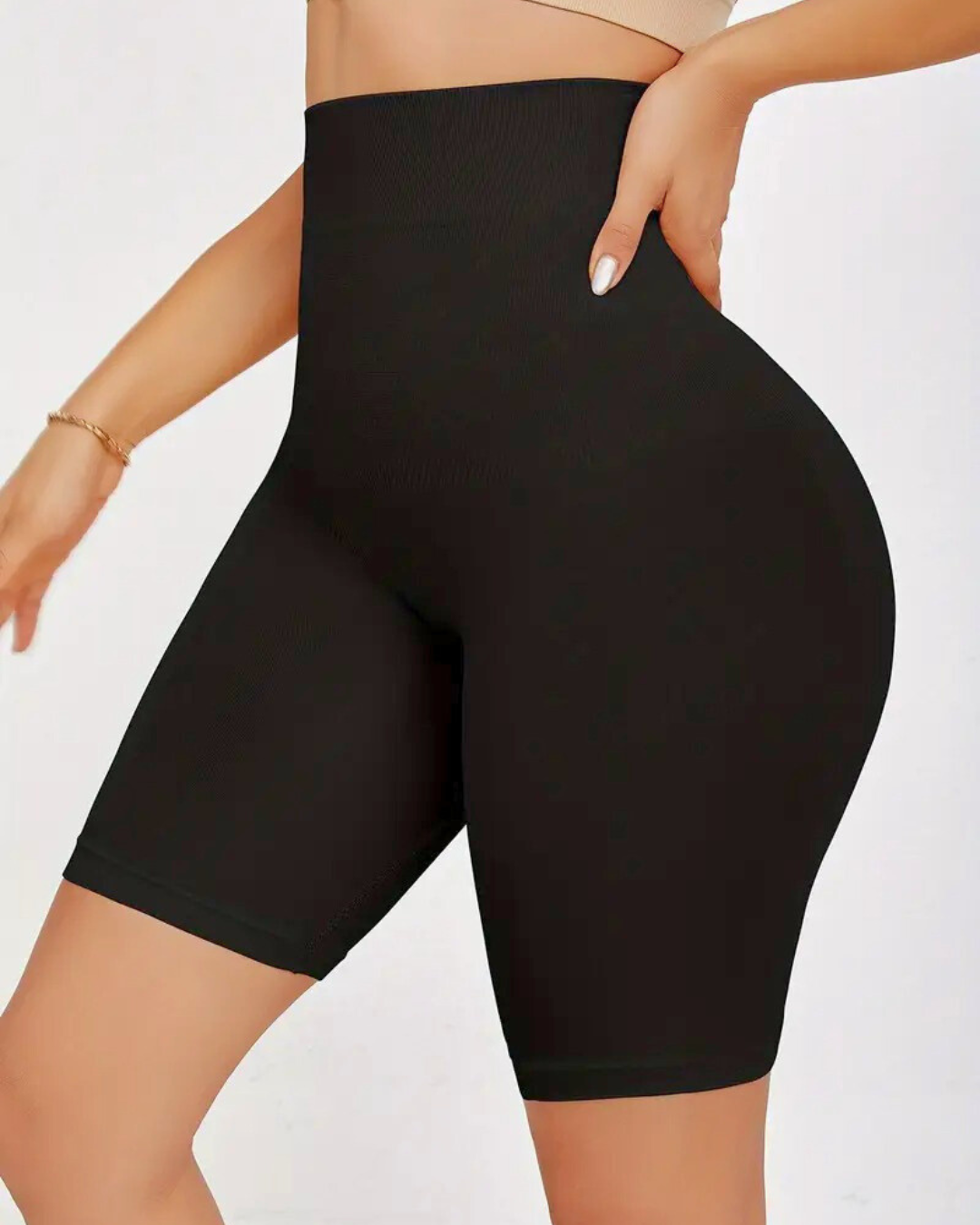 High waist seamless shapewear shorts in black for tummy control and smoothing under dresses.