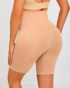 High waist seamless shapewear shorts in beige, designed for tummy control and smoothing under clothes.