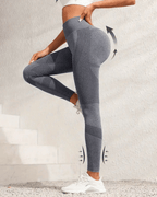 High-waist yoga leggings on a model, showcasing butt-lifting and tummy control features in a stylish gray design.