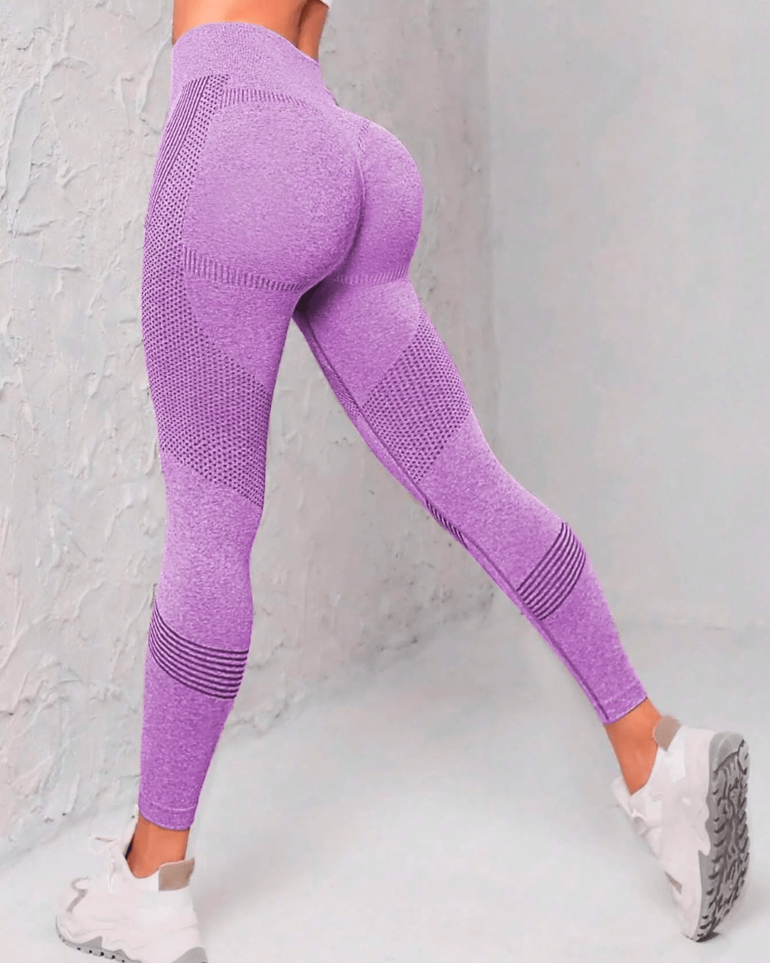 High-waist purple yoga leggings with butt-lifting design, perfect for workouts or casual wear.