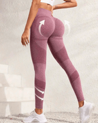 Woman wearing high-waist yoga leggings showcasing butt-lifting design, perfect for workouts and everyday wear.