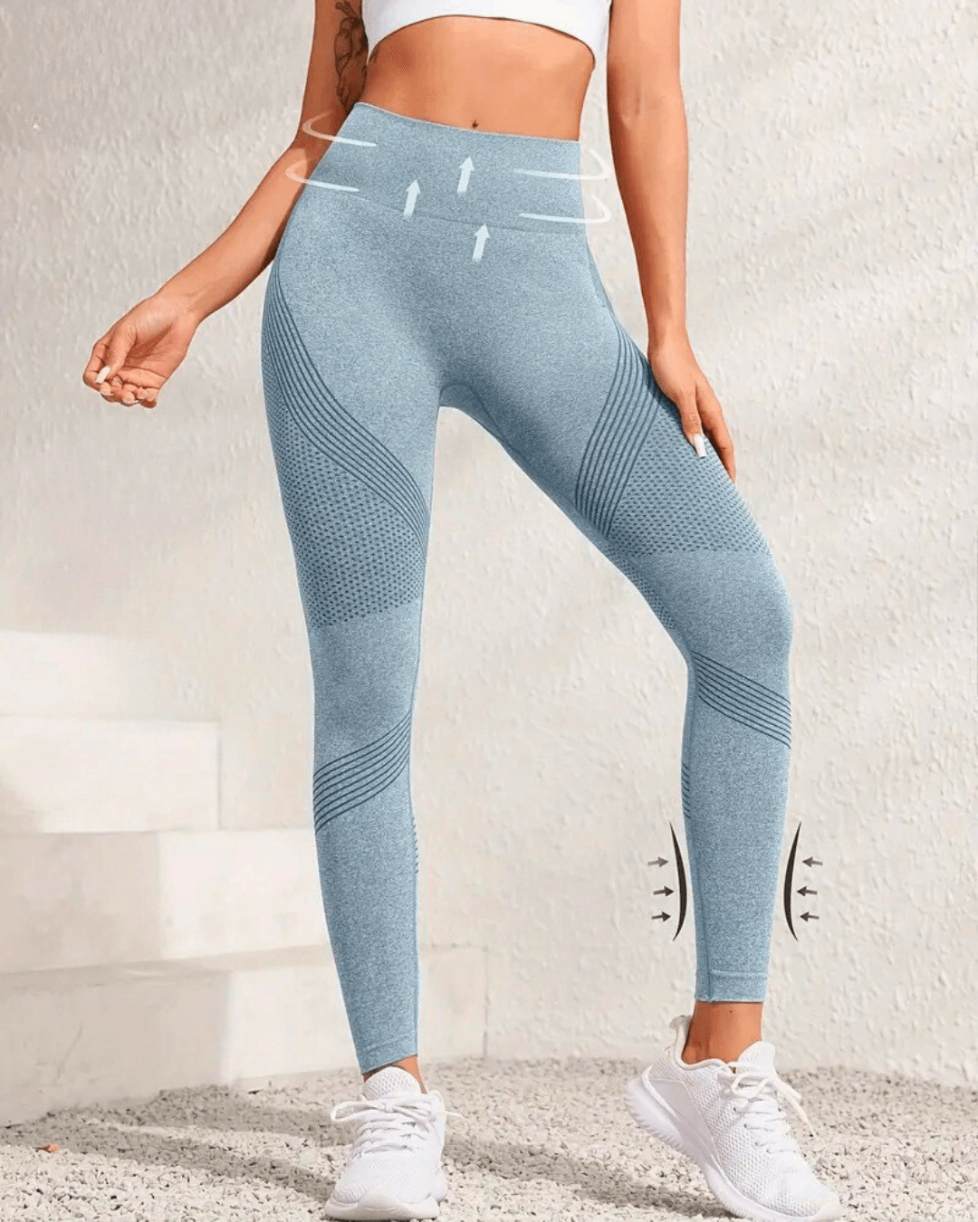 High-waist blue yoga leggings with tummy control and butt-lifting features, perfect for workouts and all-season wear.