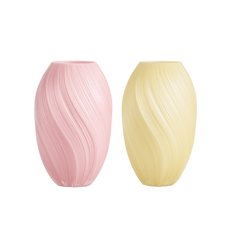 Elegant pink and yellow spiral glass vases, perfect for showcasing flowers and enhancing home decor.