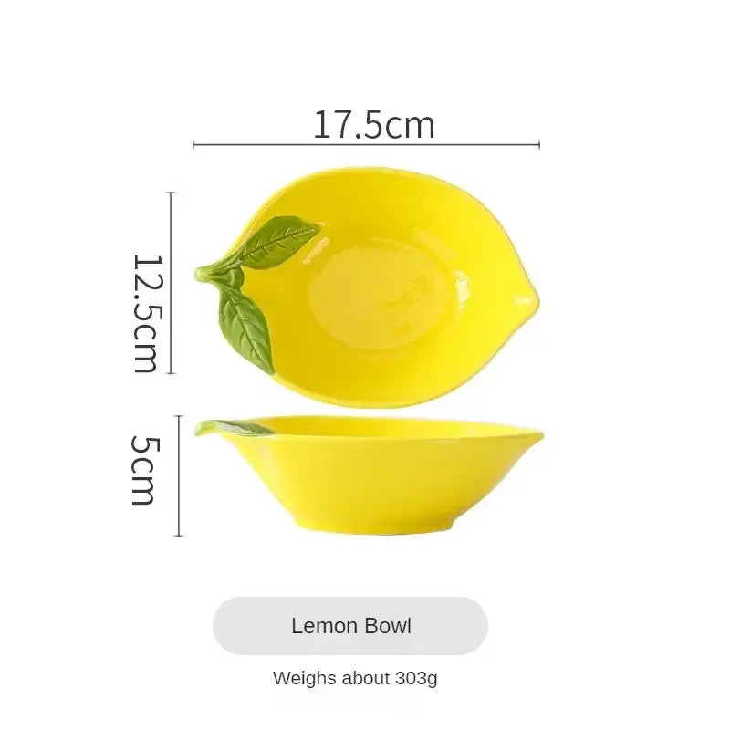 Lemon-shaped ceramic bowl with leaf detail, measuring 17.5cm x 12.5cm x 5cm, perfect for snacks and desserts.