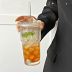 Ribbed 600ml matcha glass tumbler with clear lid and straw, filled with iced tea and mint leaves.
