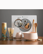 Japanese matcha tea set featuring a bowl, whisk, scoop, and strainer for traditional tea preparation.