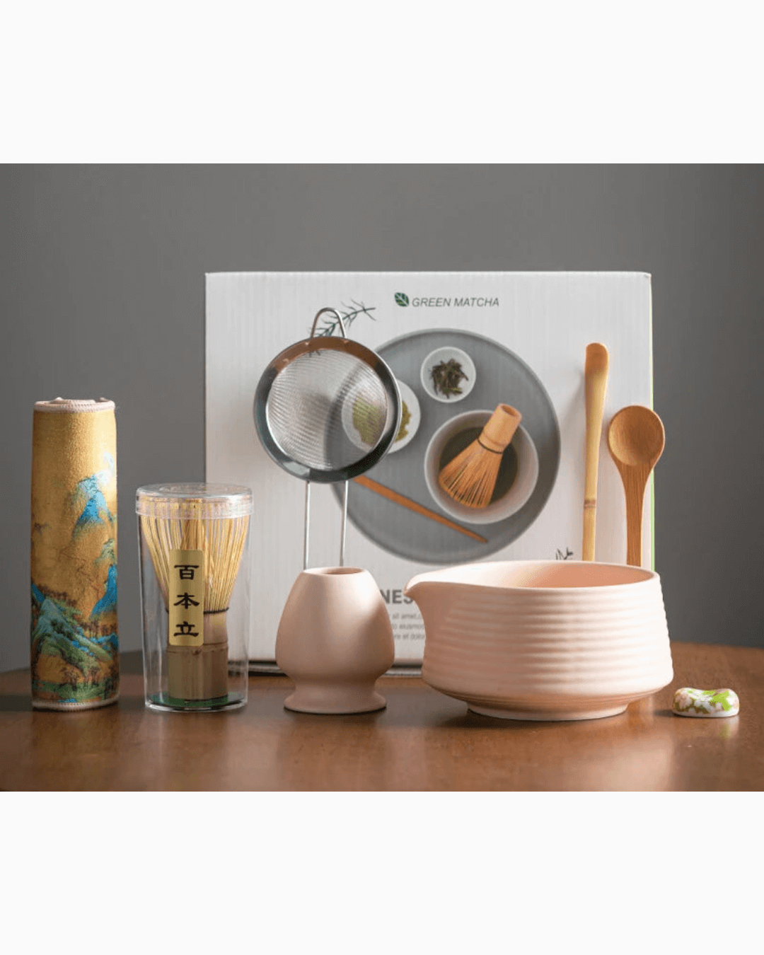 Japanese matcha tea set featuring a bowl, whisk, scoop, and strainer for traditional tea preparation.