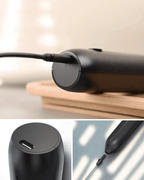 Close-up of a USB-C rechargeable matcha whisk frother with a sleek black design.
