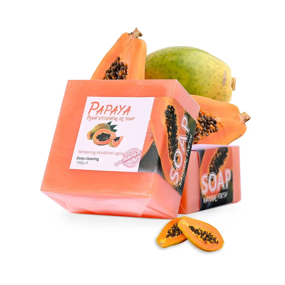 Natural papaya soap bar with fresh papaya, promoting deep cleansing and skin brightening benefits.