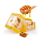 Natural honey soap bar with a honey dipper, showcasing its moisturizing properties and vibrant yellow color.