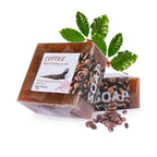 Coffee essential oil soap bar with coffee beans and leaves, offering refreshing deep cleansing for invigorating care.