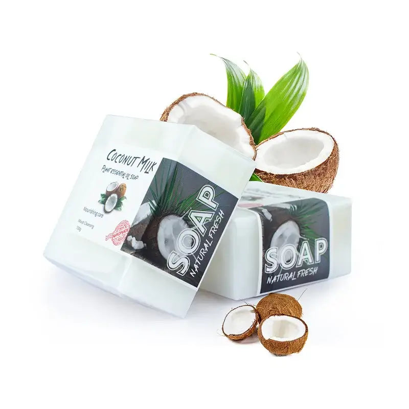 Coconut milk soap bar with fresh coconuts, packaged for natural skincare and moisturizing benefits.