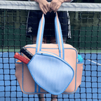 Waterproof neoprene padel racket bag with external sleeve, stylish design, perfect for carrying to the court.