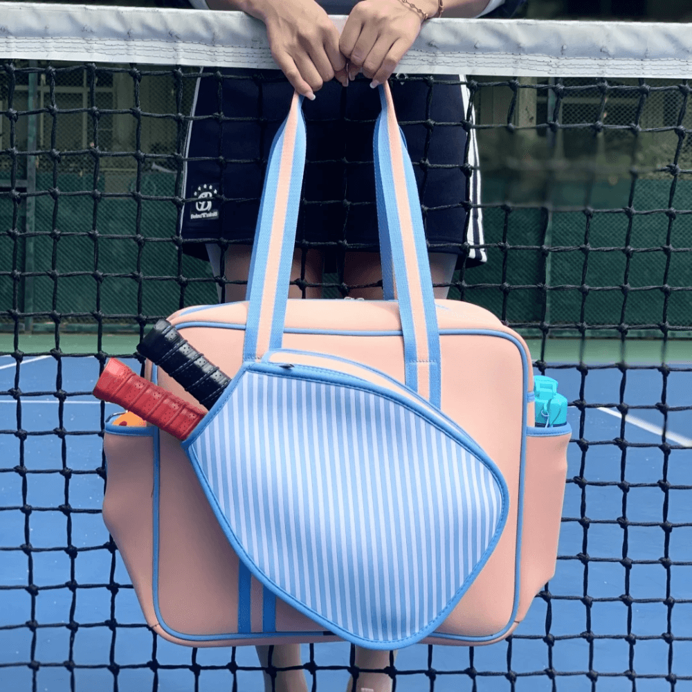 Waterproof neoprene padel racket bag with external sleeve, stylish design, perfect for carrying to the court.