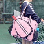 Waterproof pink padel racket bag with external sleeve and water bottle holder, perfect for court essentials.