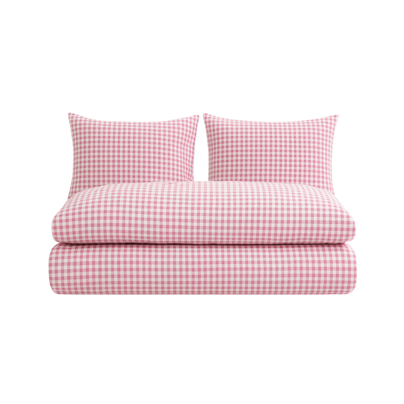 Pink gingham bedding set with cozy duvet and matching pillows, lightweight woven polyester for effortless elegance.