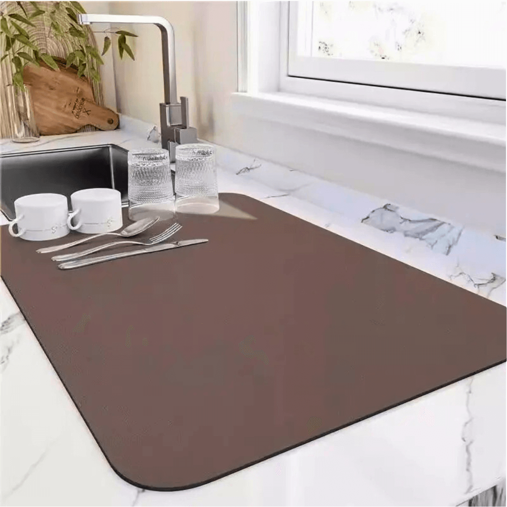 Quick-drying kitchen mat next to sink, showcasing its absorbent surface for drying dishes and cookware.