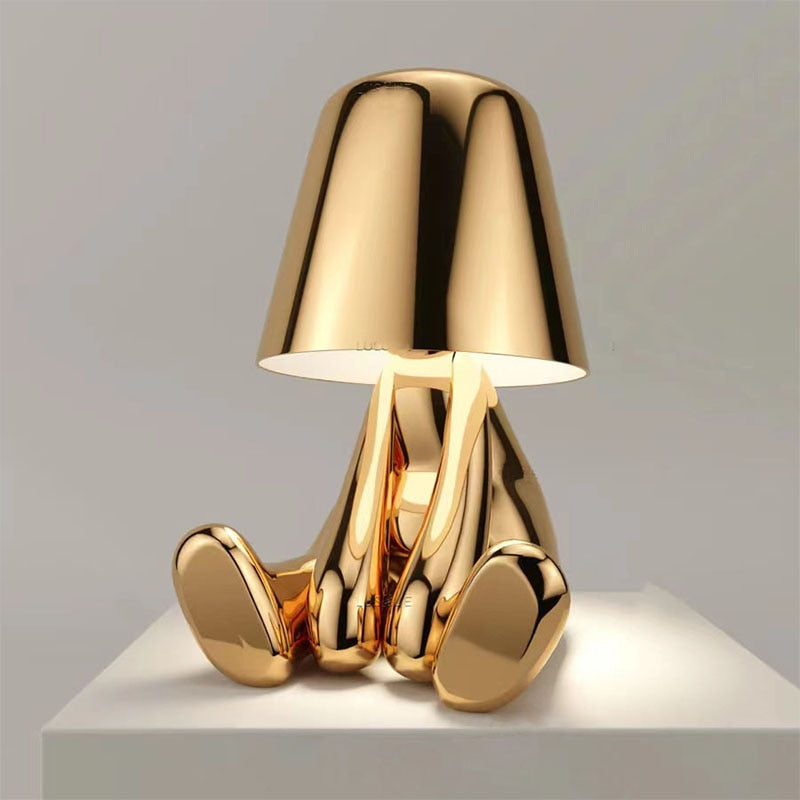 Stylish LED figure lamp in gold design, featuring a touch dimmer for a cozy atmosphere.