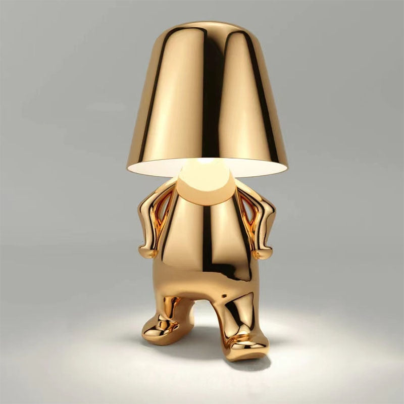 Stylish golden LED figure lamp with a unique design, perfect for modern home decor and creating a cozy atmosphere.