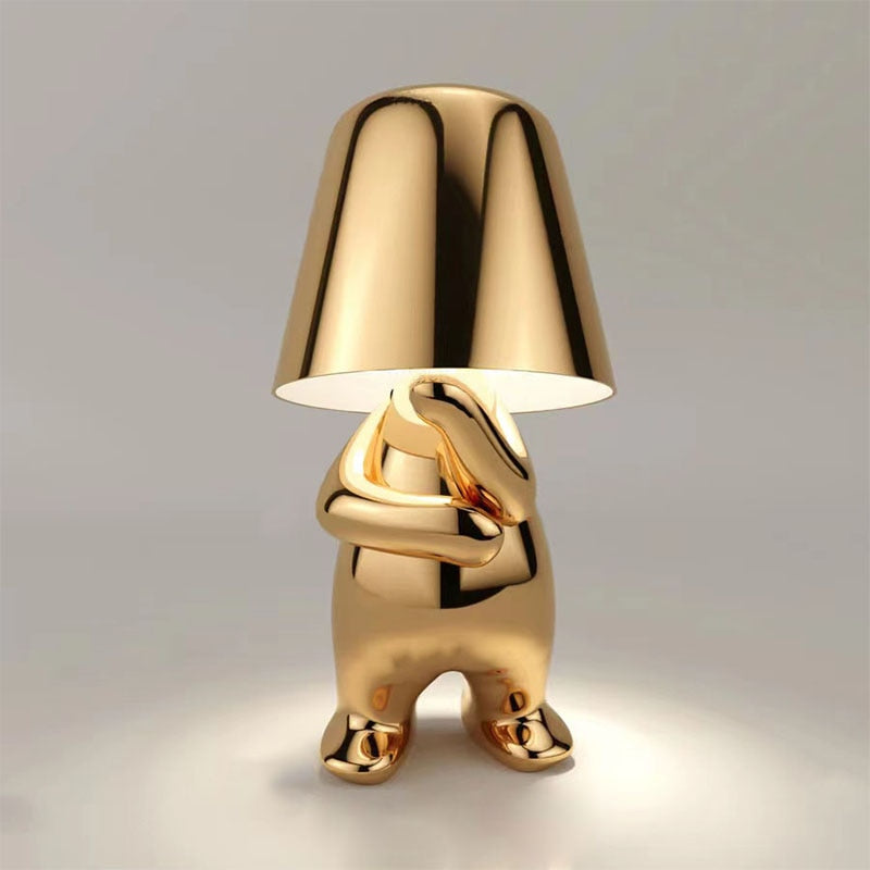 Stylish gold LED figure lamp with a modern design, perfect for enhancing any room's ambiance.