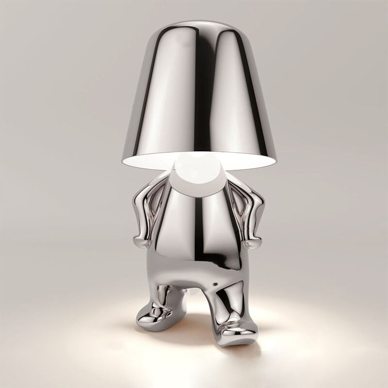 Stylish LED figure lamp with a modern chrome finish, perfect for creating a cozy atmosphere in any room.