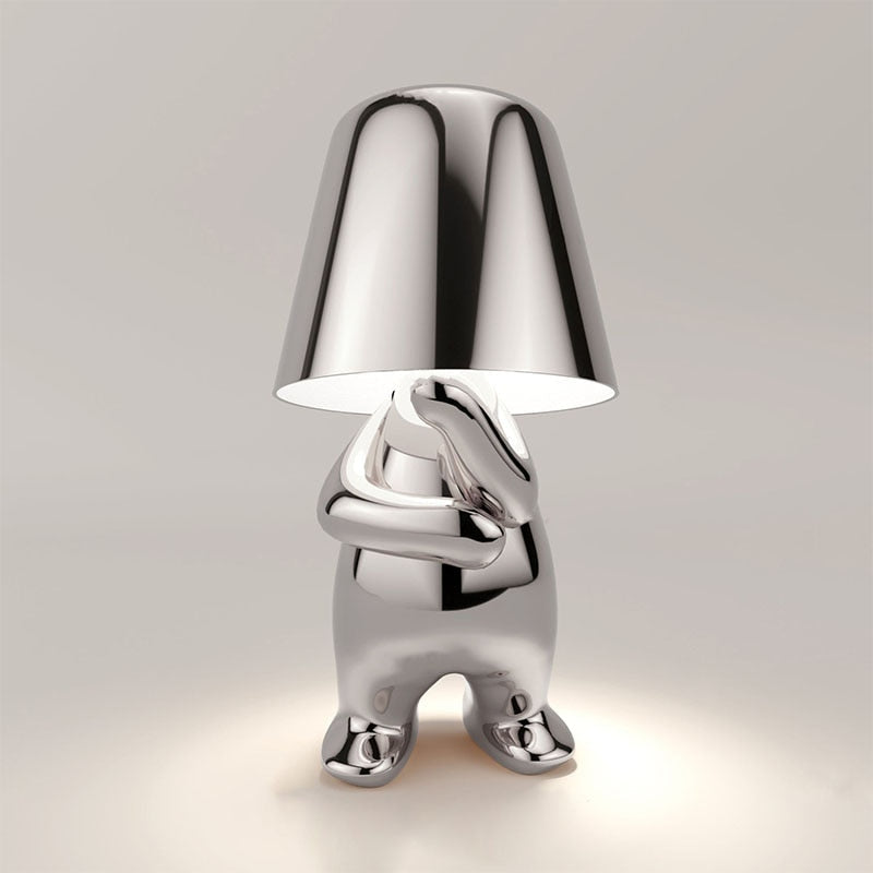 Stylish LED figure lamp in a shiny metallic finish, featuring a modern and playful design for cozy ambiance.