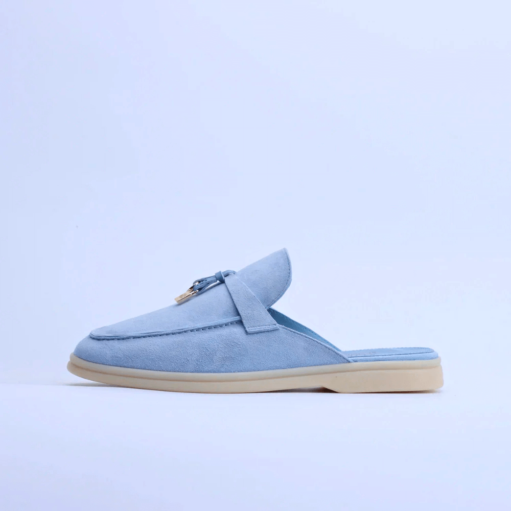 Women’s suede loafers in light blue with tassel accent, premium slip-on backless design for casual elegance.