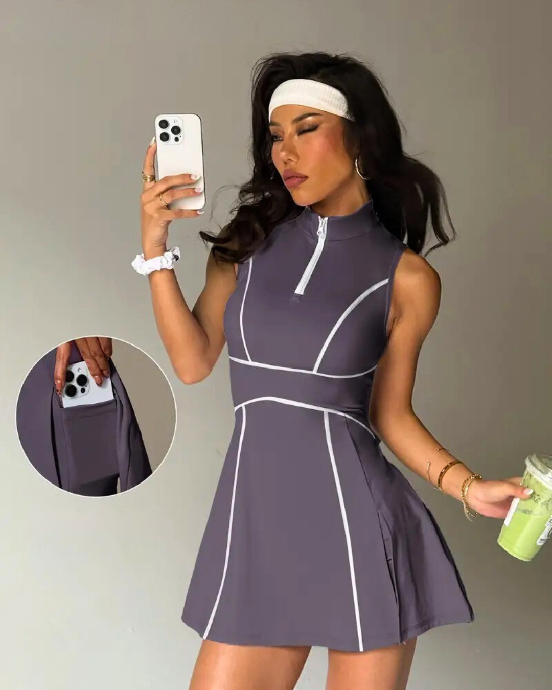 Model wearing a stylish padel tennis dress with built-in shorts, zip polo neck, and pockets for convenience.