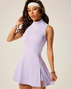 Lilac padel tennis dress with built-in shorts, zip polo neck, and flared skirt, perfect for on-court performance.