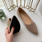 Pointed toe flats in soft faux suede with a black sole, showcasing comfort and style for everyday wear.