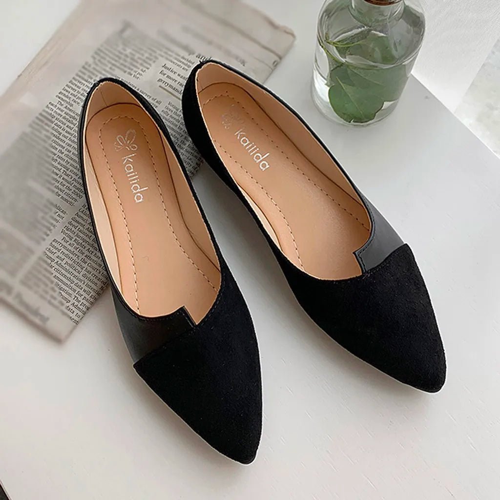 Pointed toe black ballet flats made of soft faux suede, featuring an elegant slip-on design for comfort and style.